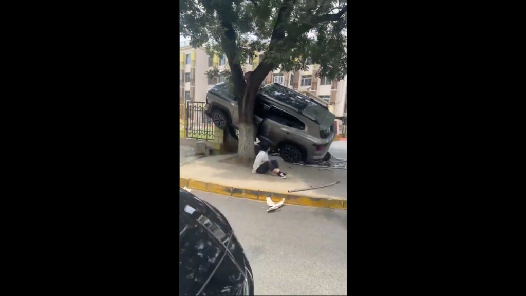 Children seen injured on road after car collision in Beijing