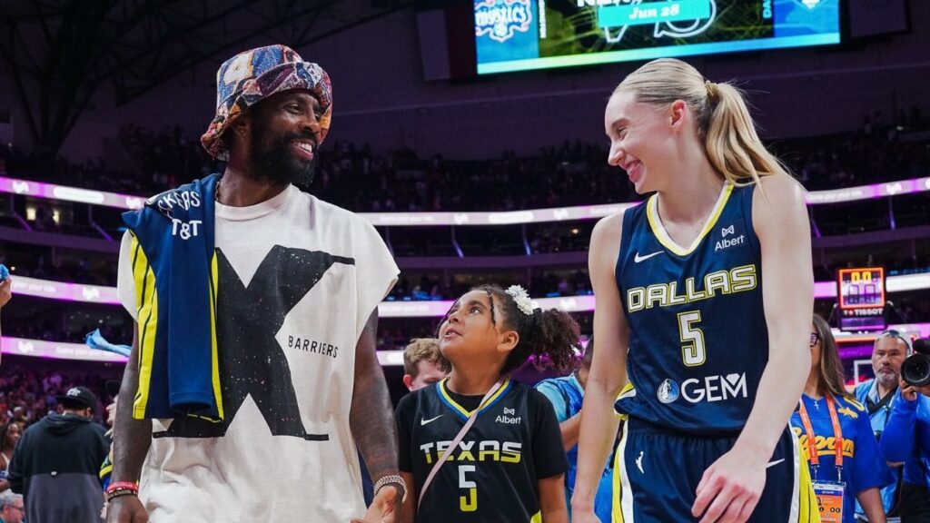 Paige Bueckers poses with Kyrie Irving, signs jersey after Fever-Wings
