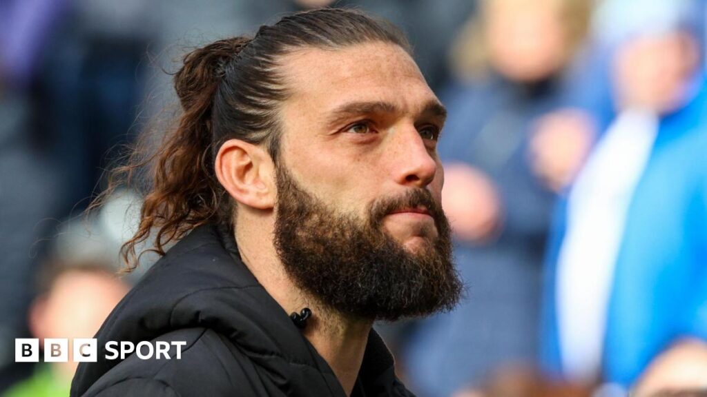 Andy Carroll looks in the distance