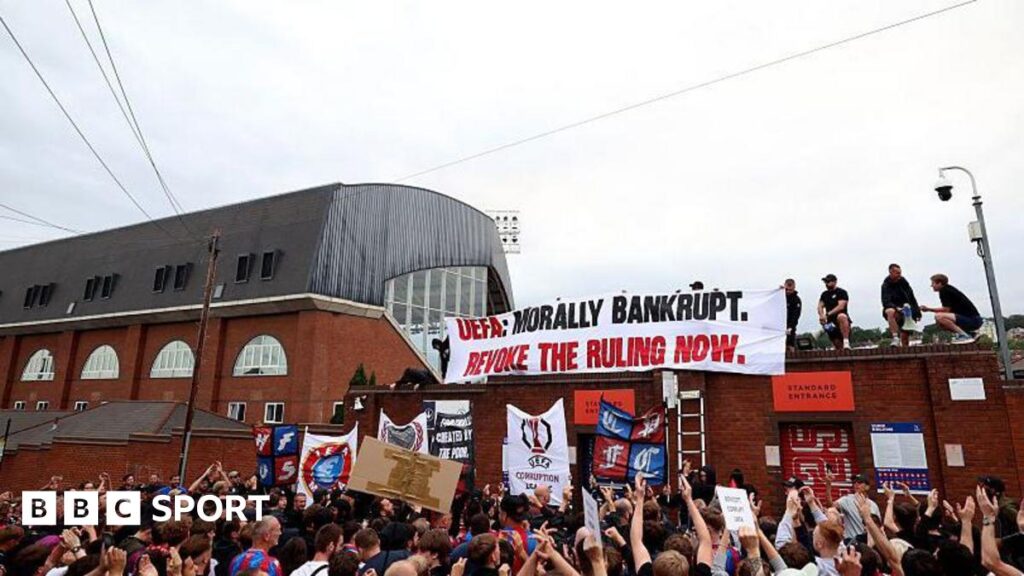 Crystal Palace fans protest at Selhurst Park about their demotion to the Uefa Conference League