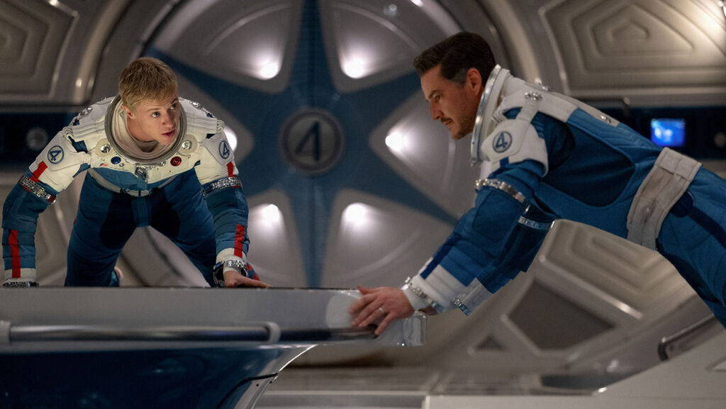 (L-R) Joseph Quinn as Johnny Storm/Human Torch and Pedro Pascal as Reed Richards/Mister Fantastic in The Fantastic Four: First Steps
