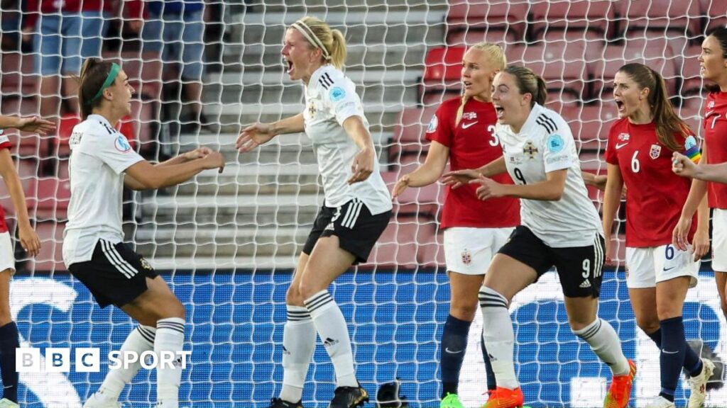 Julie Nelson celebrates her goal
