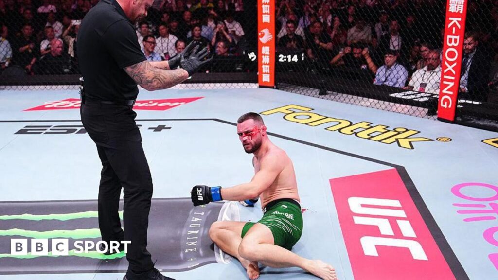 Kiefer Crosbie is bloodied as he lays on the canvas